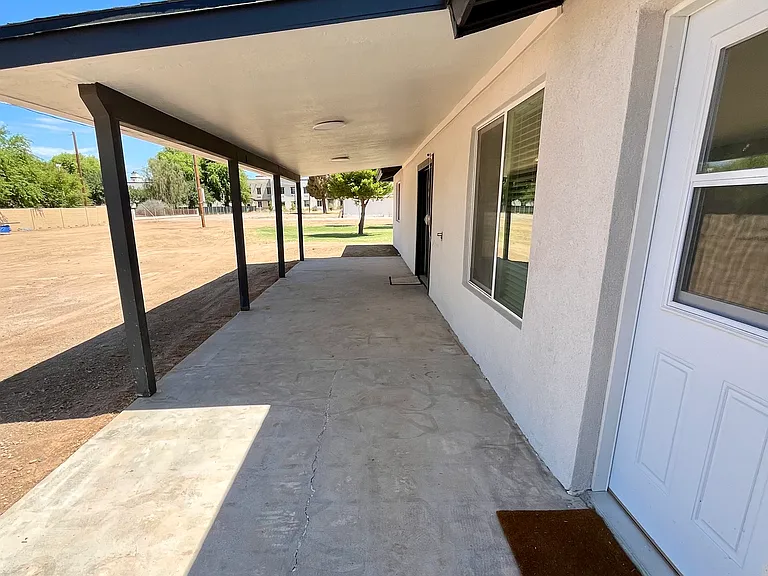 Additional views of backyard covered patio.