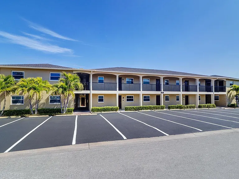 Streetside view of Bougainvillas On The Bay