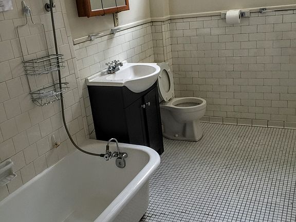 Ceramic tile bath/refinished tub