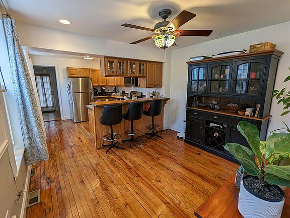 Dining room + kitchen with lots of natural light due to being on the end of the block!