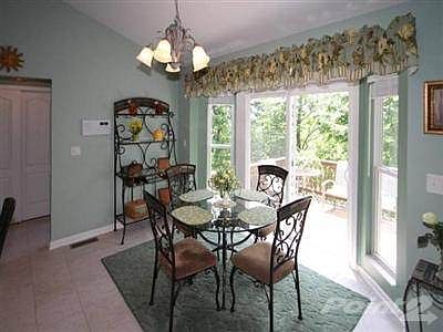 Sunny breakfast bay with walkout to freshly stained deck. Enjoy the views & this peaceful setting!
