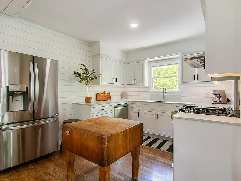 Kitchen modern updated with antique heirloom chopping block.