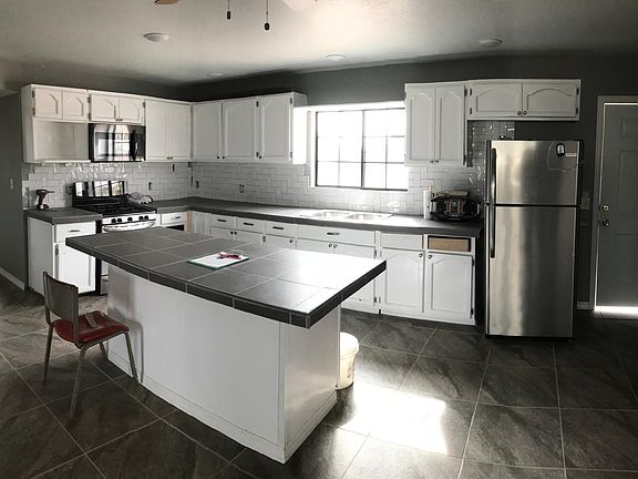 Large open concept living room, three bedrooms with large closets in each, 1 full bathroom and one bathroom with shower.Carport available.