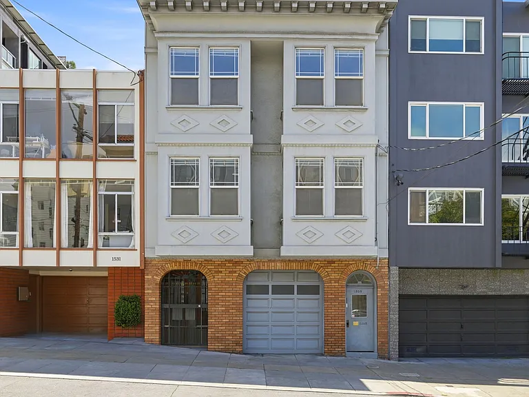 Front of the overall property. 1537 Filbert is the white unit on the left, above the brick facade.