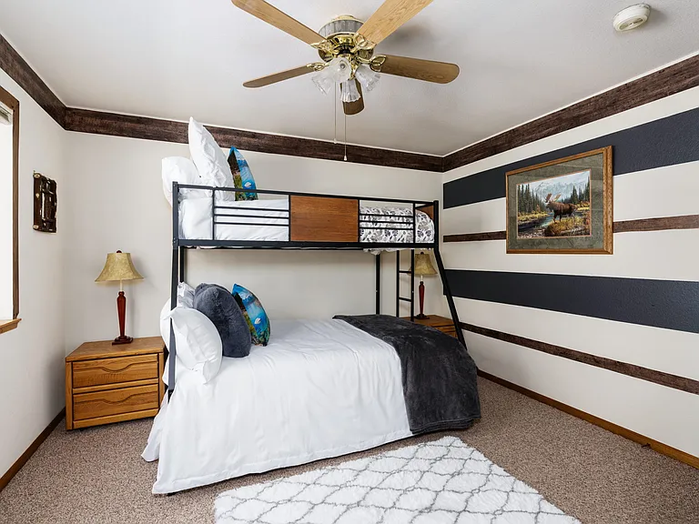 Upstairs guest room with TRIPLE bunk bed. Twin top, Full bed bottom, and bottom roll out Twin bed.