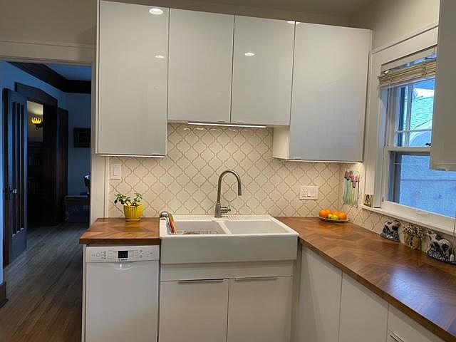 Remodeled Kitchen with Tile Backsplash, Wood Countertops and New Appliances