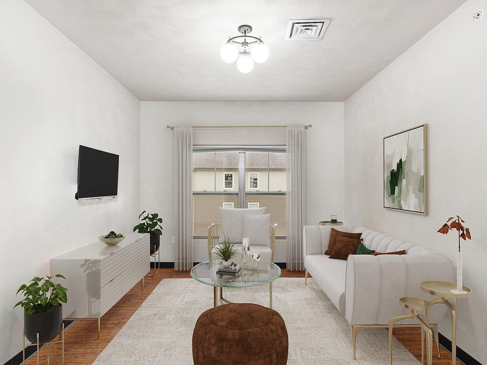 Apartment features a spacious, open-concept living room...