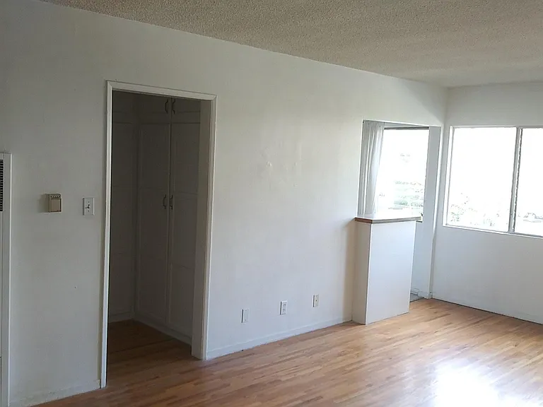 Huge Main Bedroom with kitchenette/wet bar/storage area.