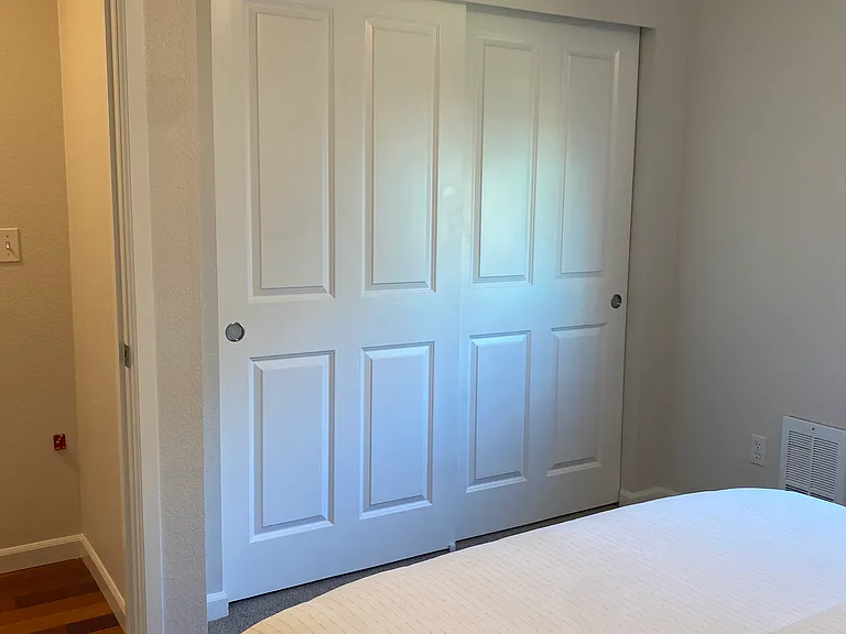 An 8 foot long closet like this is available in each of the apartment's two bedrooms.