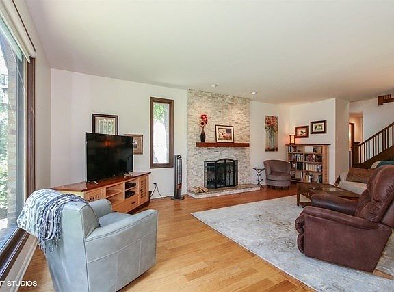 New Stone Fireplace Facade and that beautiful hardwood flooring.