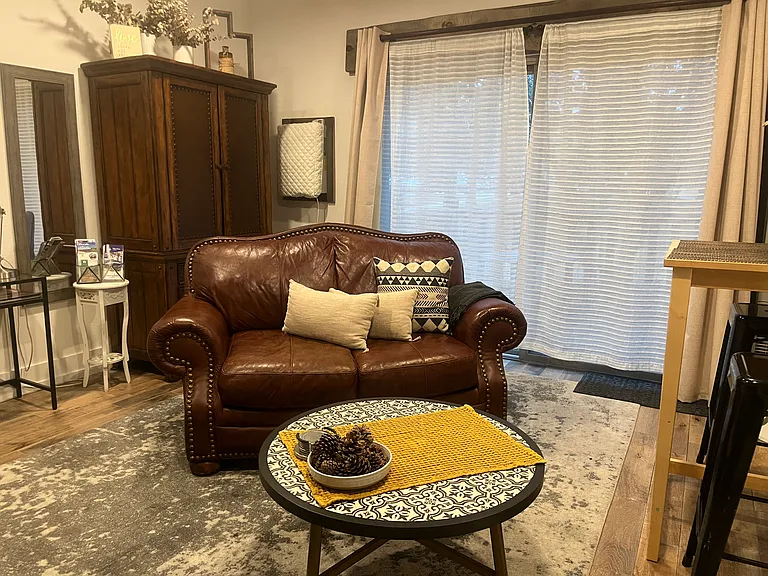 Leather loveseat with coffee table.