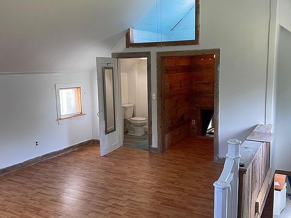 Upstairs primary bedroom with en-suite half bath