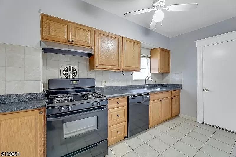 Kitchen with Stove, Dishwasher, Sink, and Refrigerator