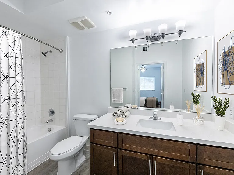 Well-appointed bathrooms are complete with ample storage.