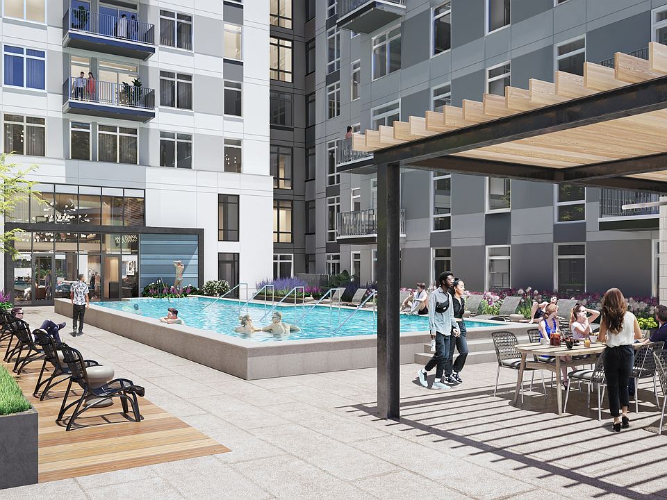 Relax on our elevated entertainment deck featuring a resort-style pool and sundeck