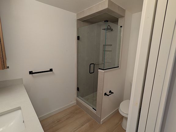 This is a private bathroom for Unit 4 only. It is not attached to the room, but it is in the hallway outside the bedroom door.
