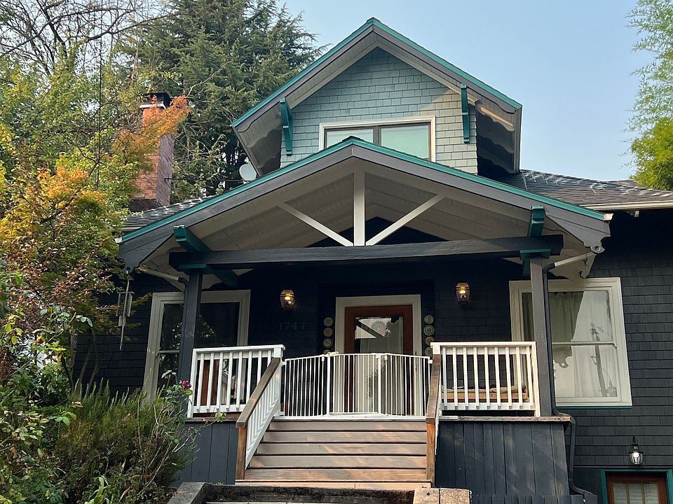 Elevated approach to front door. Basement access on right off driveway.