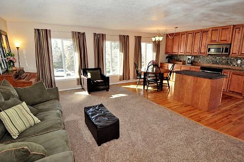 Living Room w/ Light Neutral Walls/Carpet & 3 Large Windows