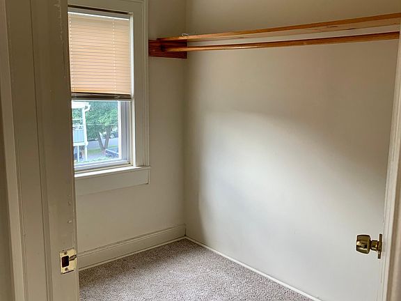 Walk-in closet off of kitchen next to bathroom