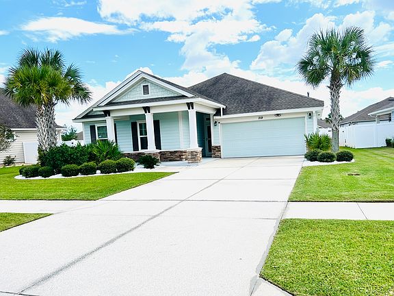 Charming curb appeal on a spacious lot with manicured landscaping and wide separation between houses