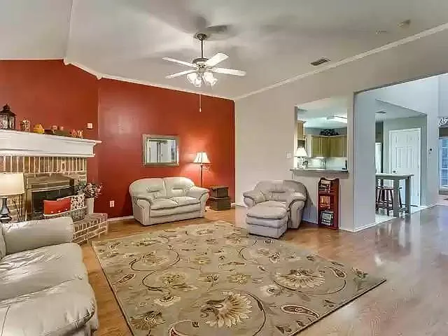 Another view of the living room connected to the kitchen