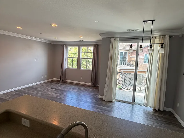 Kitchen opens seamlessly to the living and dining areas.