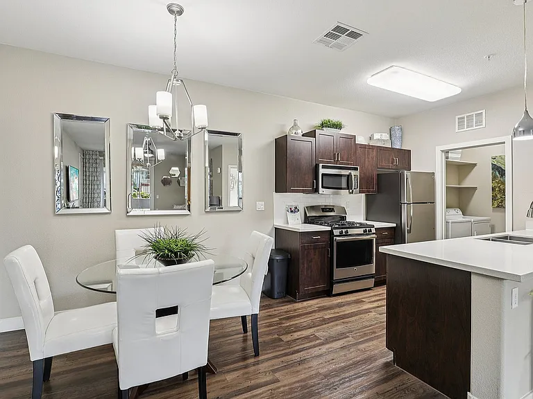 Dining Area and Kitchen with Stainless Steel Appliances