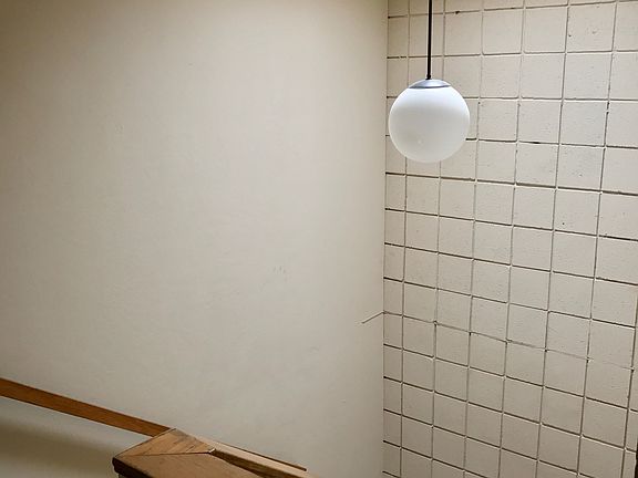 stairwell glows with natural light from skylight