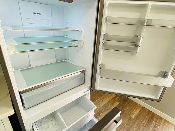 Brand new refrigerator with ice maker.