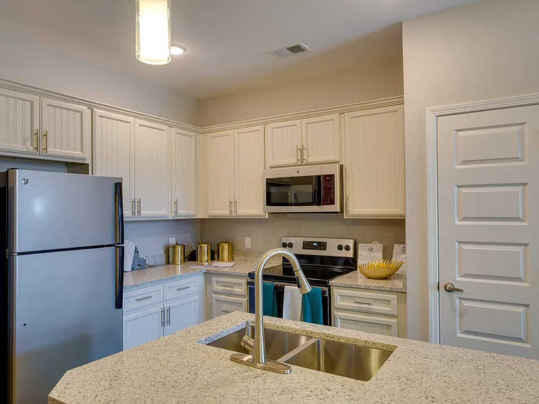 Fully Equipped Kitchen Includes Frost-Free Refrigerator, Electric Range, & Dishwasher