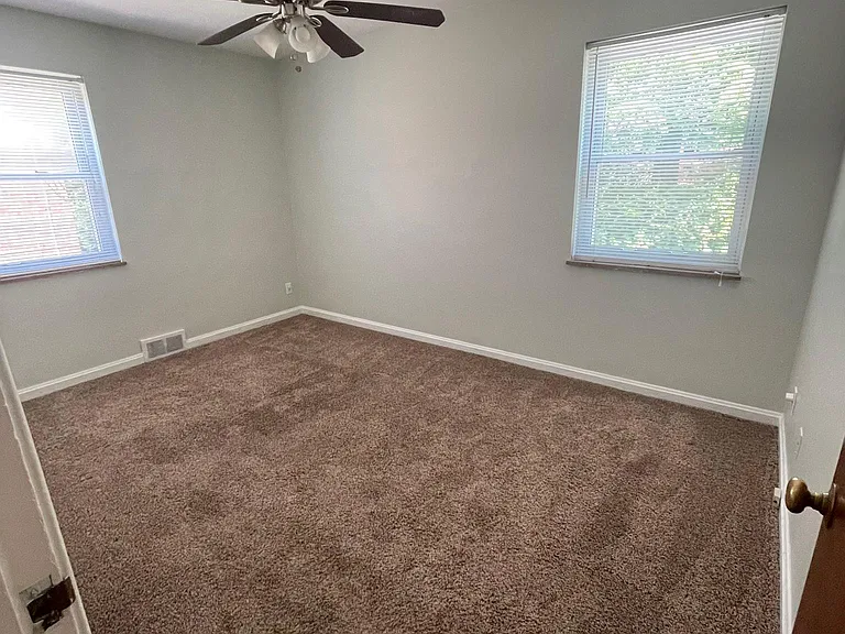 Large 2nd bedroom with ceiling fan.