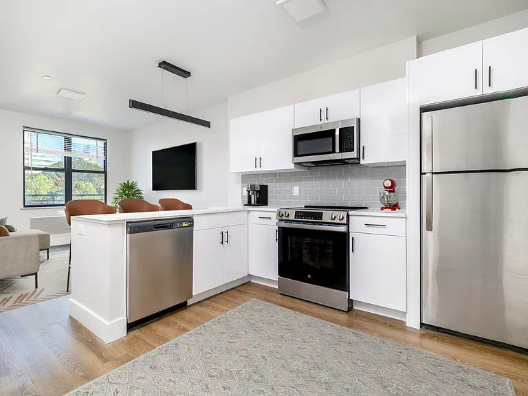 Stylish lighting and black accents. Tons of cabinet space.