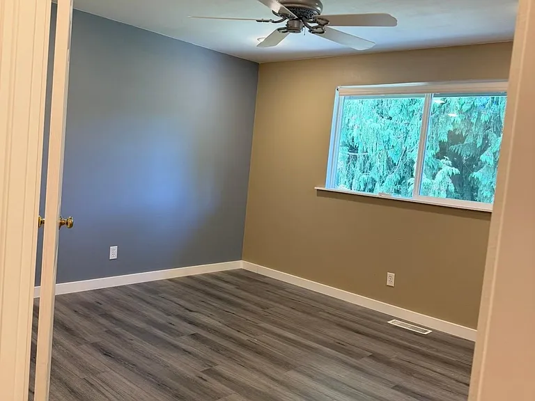 Looking in the master bedroom from hallway. Double door entrance.