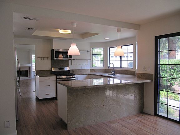 STONE COUNTERS WOOD FLOORS
