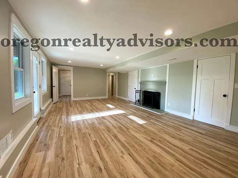 Large Second Living Room on Lower Level Looking Towards 2 Bedrooms with Shared Bath