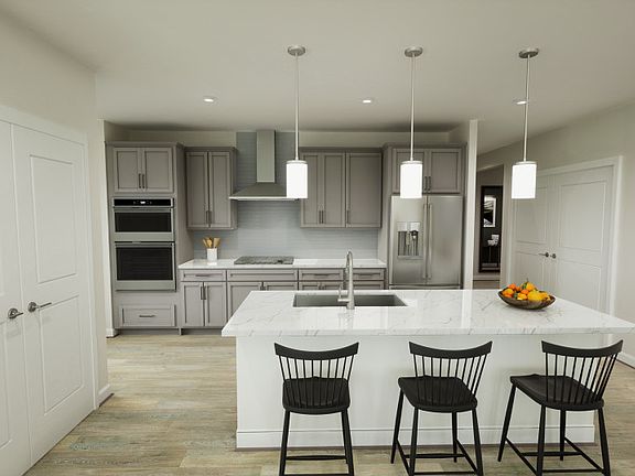 Kitchen Overlooks Dining Room and Living Room