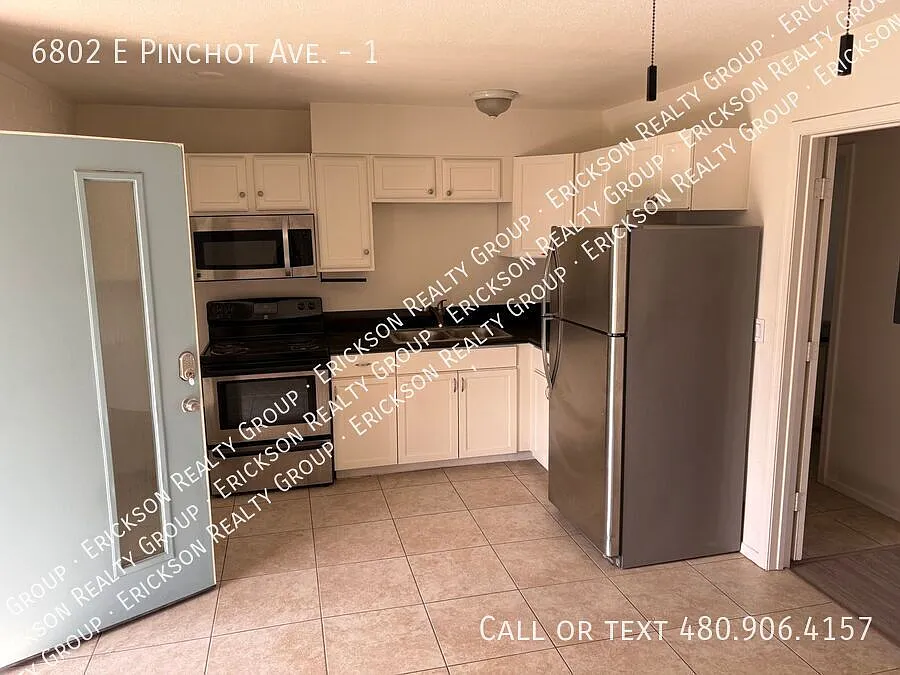 Building Photo - 6802 E Pinchot Ave #1