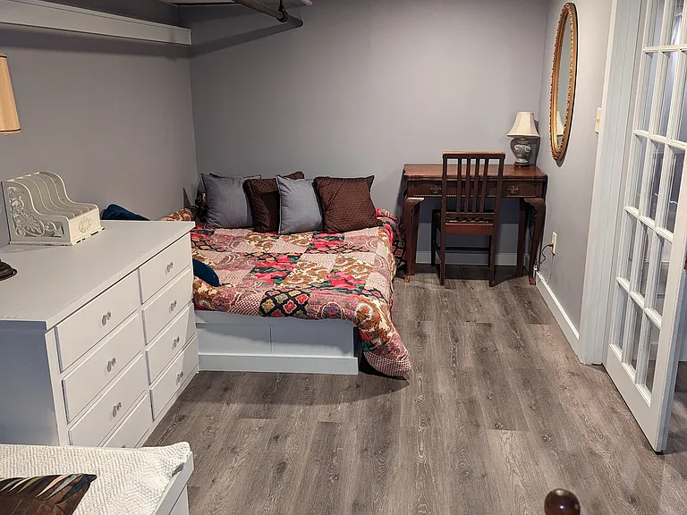 Large Bedroom, Two Beds (one full + one single) with Two Casement Windows.