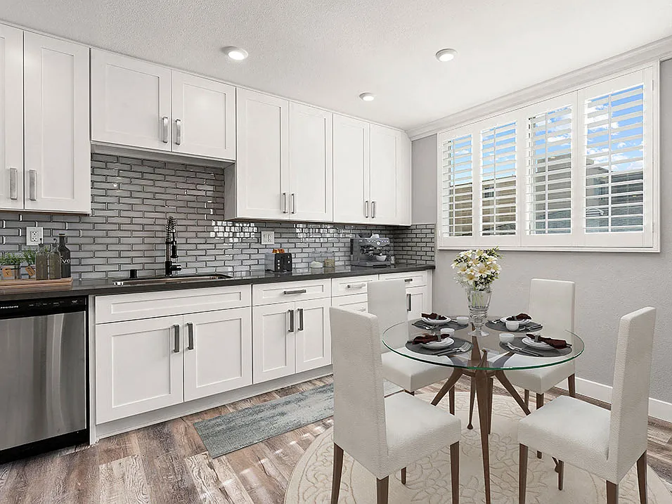 Hardwood floored dining room with view of gorgeous tiled kitchen.
