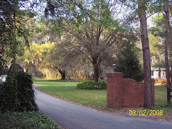 Gated entrance to neighborhood - home on the right