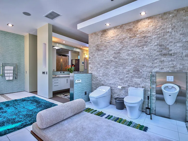 master bedroom bahroom with Bidet, urinal and regular toilet relaxation couch