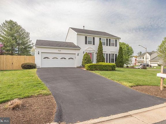 Large driveway and two car garage