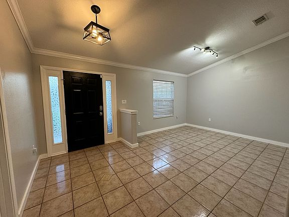 Front entry way is spacious and bright. Can be used as a formal living or dining area.