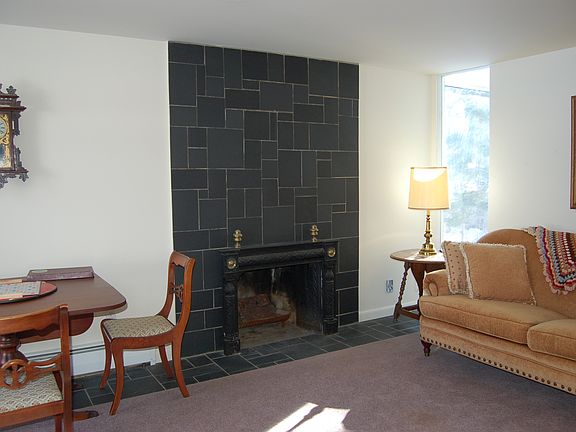 slate fireplace and floor in formal living room