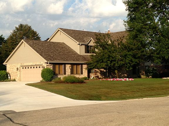 Attached 2 car garage w/large additional storage