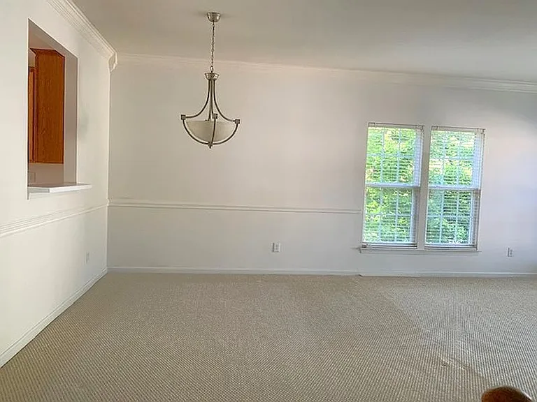 2nd floor Large Living and Dining room. The carpet will be replaced by LVP plank flooring shortly.
