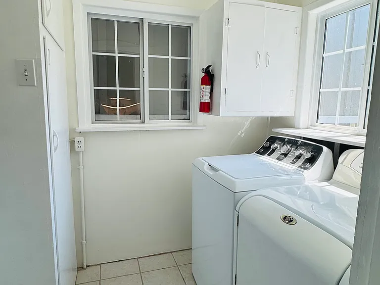 Laundry room with extra storage and pantry. Washer and dryer.
