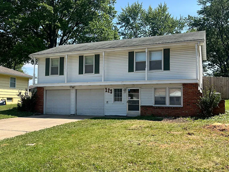 North side of home with two car garage