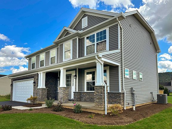 S A Homes Greenwood floorplan - front exterior view - two story home with front porch, vinyl siding,