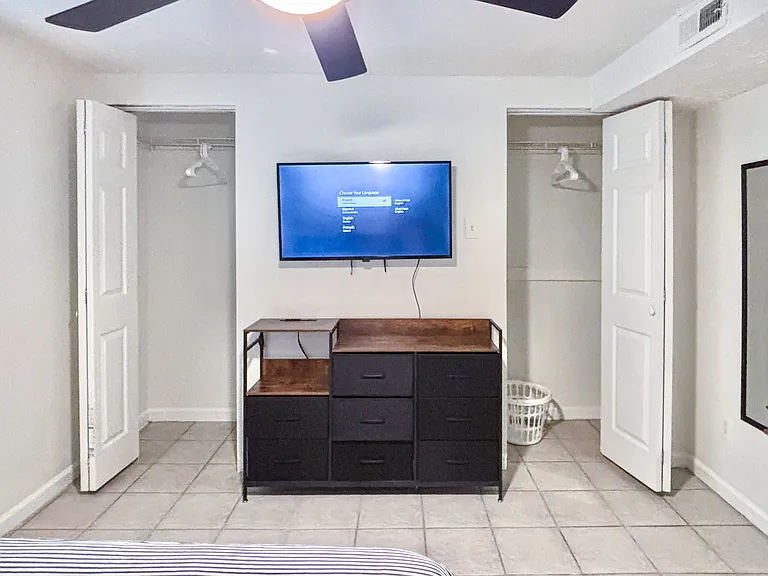 Two spacious closets with two racks each, a few hangers and a laundry basket!